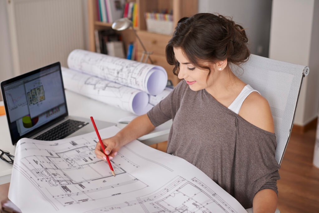 Young creative woman working on interior space planning concepts for a modern home
